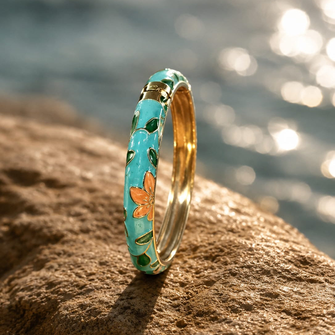 Decorative ring with floral design on a rock by a body of water