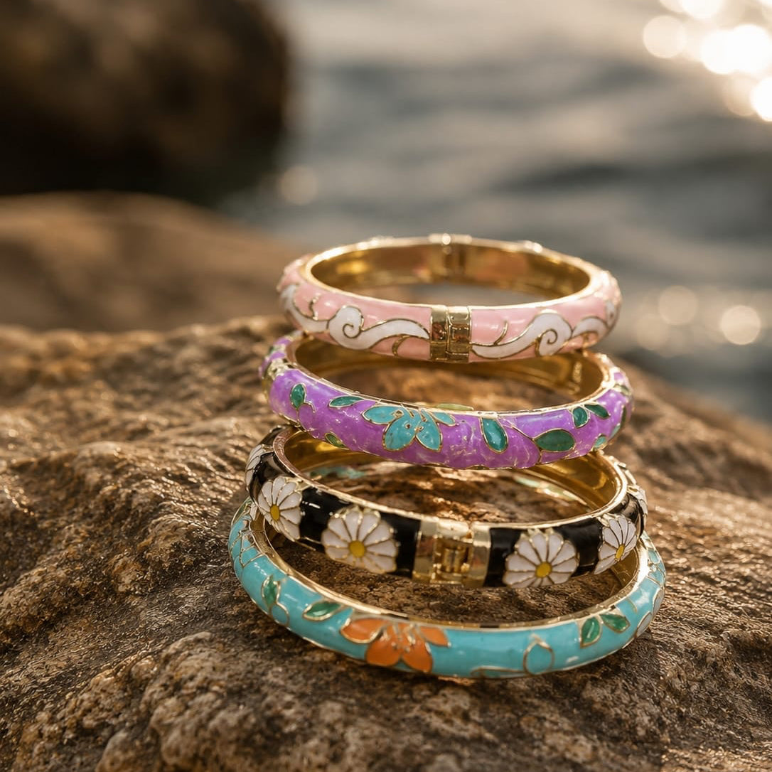 Stack of colorful rings on a rock with water in the background