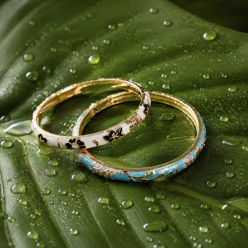 Two bangles on a green leaf with water droplets