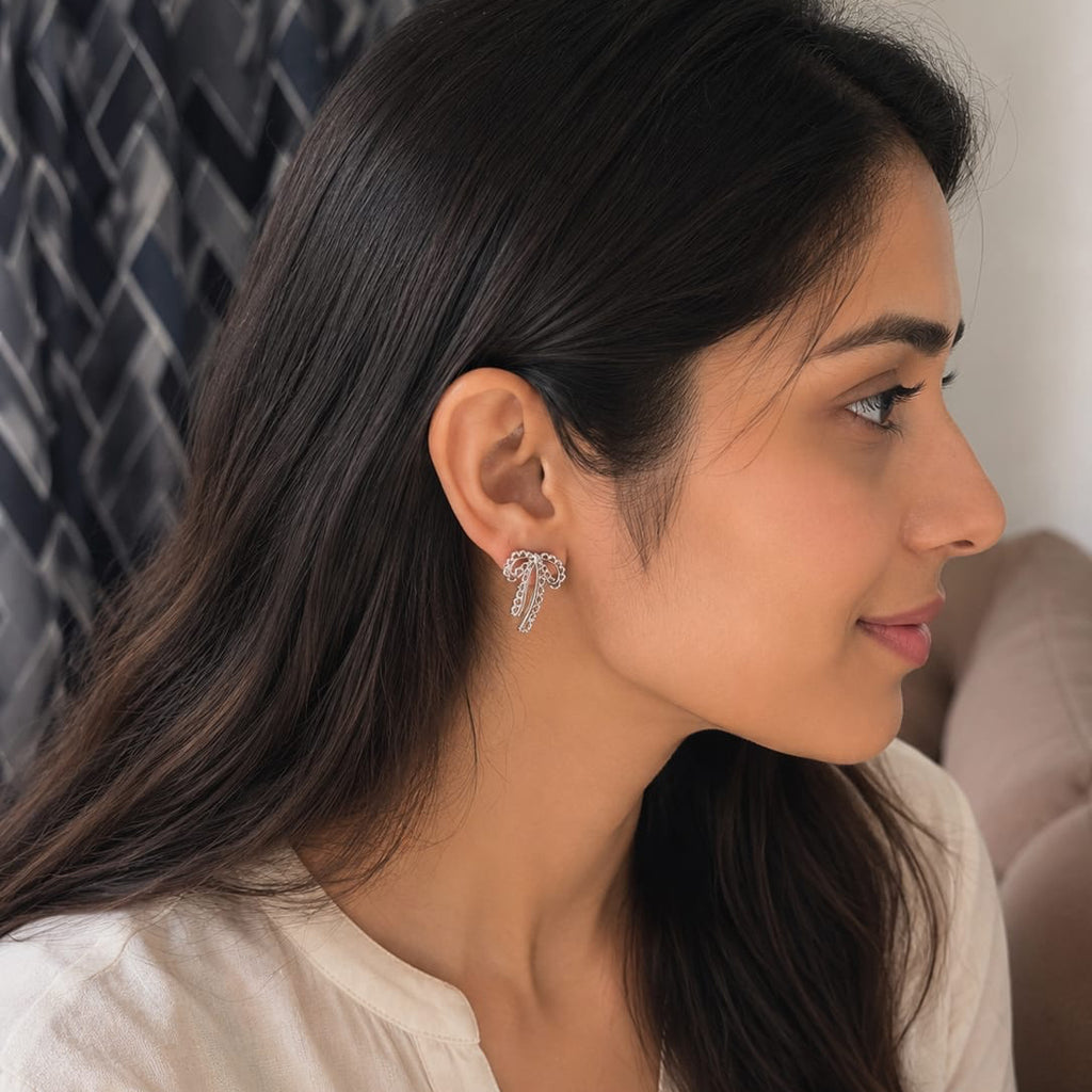 Woman wearing a diamond earring, side view