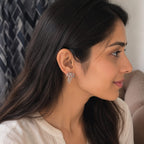Woman wearing a diamond earring, side view
